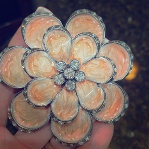 Silver, peach-pearl and rhinestone belt buckle.